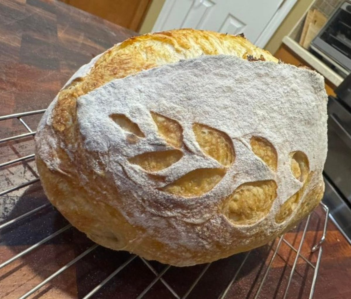 Wheat-scored sourdough loaf baked by class guest Jenny